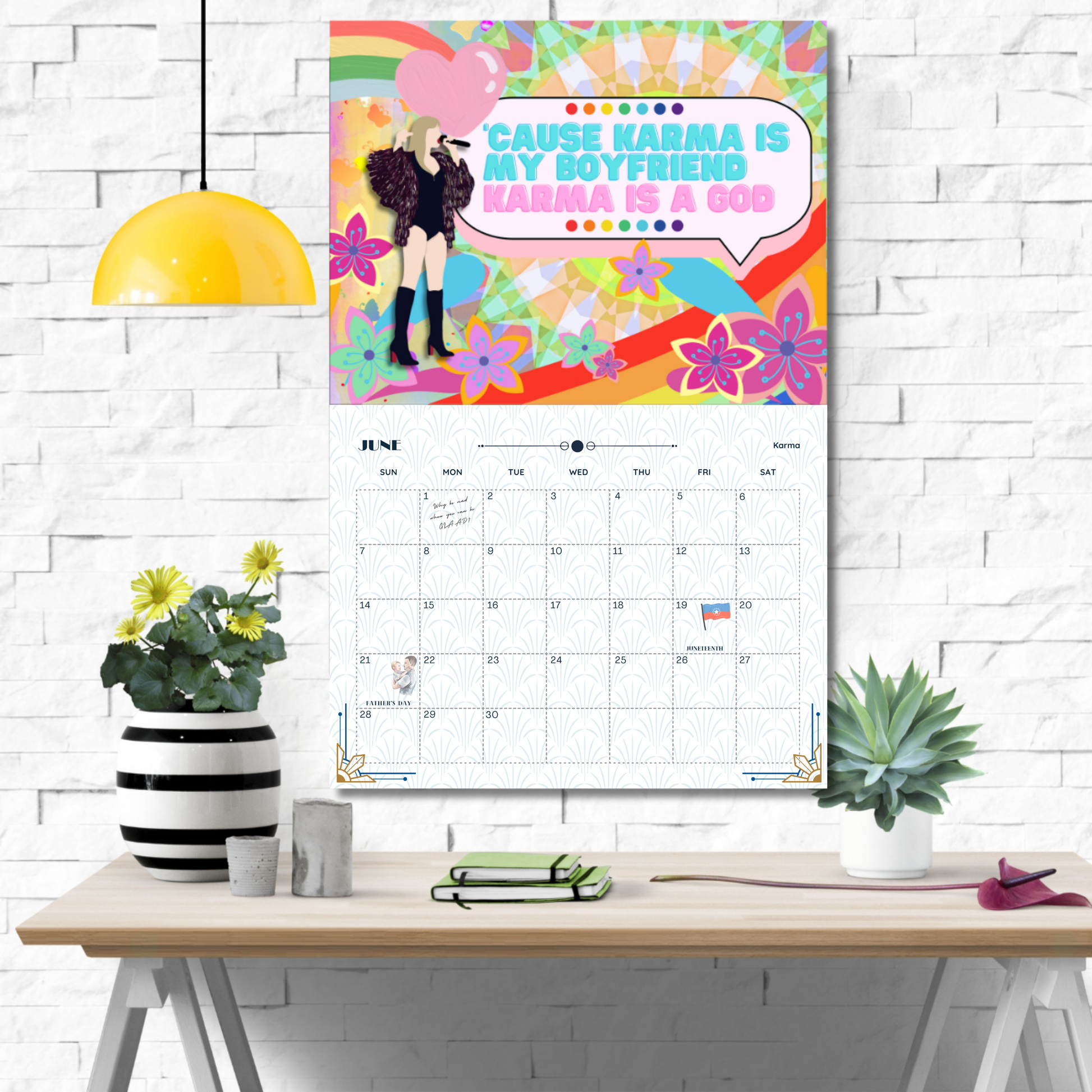 Colorful calendar with a decorative cover on a desk against a white brick wall.